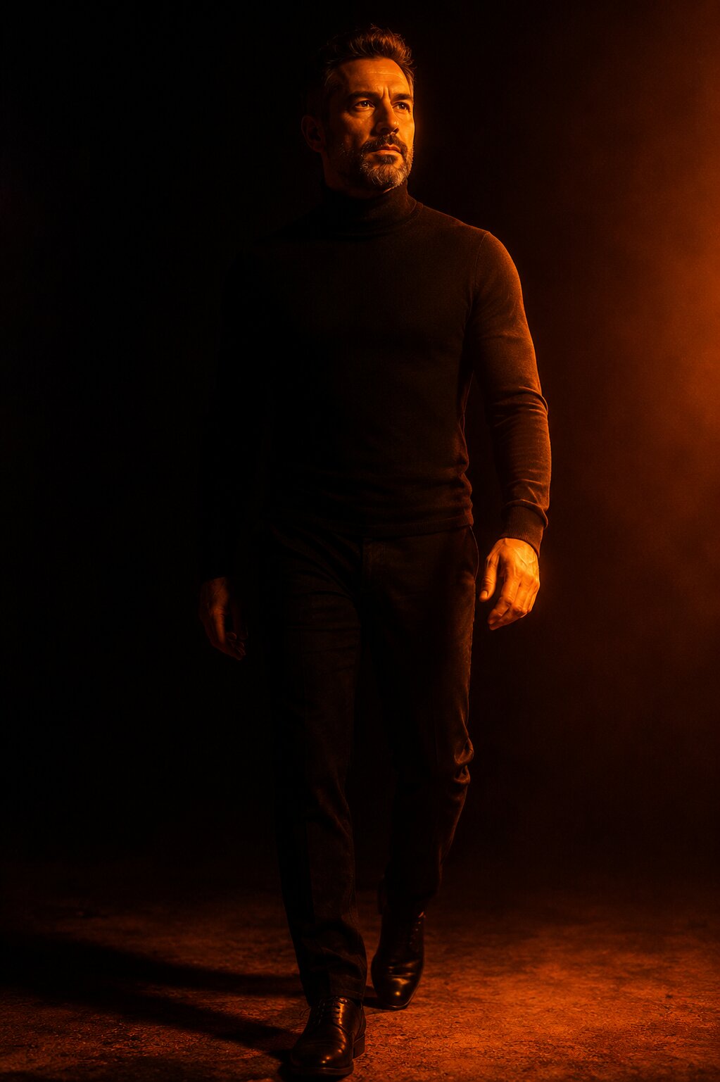 A man emerging from shadow into ember light